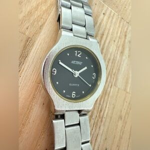 Nelsonic ladies black dial silver tone watch NEW BATTERY